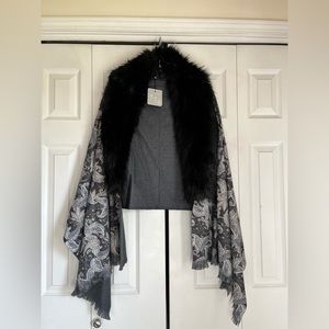 Elegant black shawl, perfect for dressing up a look.